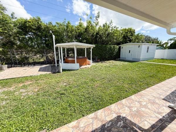 11321 SW 162nd Ter, Miami, FL 33157 - view of yard featuring a hot tub, a patio area, and view of scattered trees