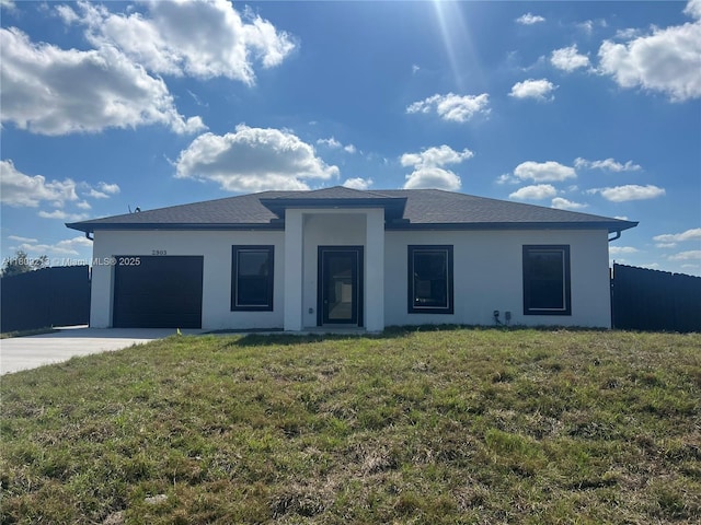 2903 W 64th St, Lehigh Acres, FL 33971 - view of front of home with concrete driveway, an attached garage, and stucco siding