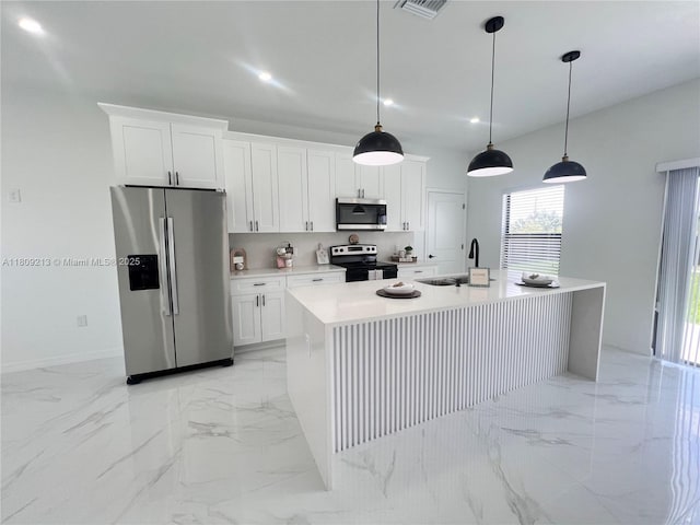 2903 W 64th St, Lehigh Acres, FL 33971 - kitchen with stainless steel appliances, a sink, light marble finish floors, and recessed lighting
