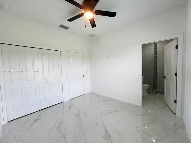 2903 W 64th St, Lehigh Acres, FL 33971 - unfurnished bedroom with marble look tiles, baseboards, ensuite bathroom, and a ceiling fan