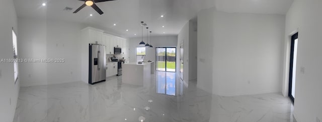 2903 W 64th St, Lehigh Acres, FL 33971 - hallway featuring light marble finish floors, recessed lighting, baseboards, and a sink