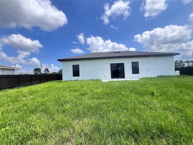 2903 W 64th St, Lehigh Acres, FL 33971 - back of house featuring stucco siding