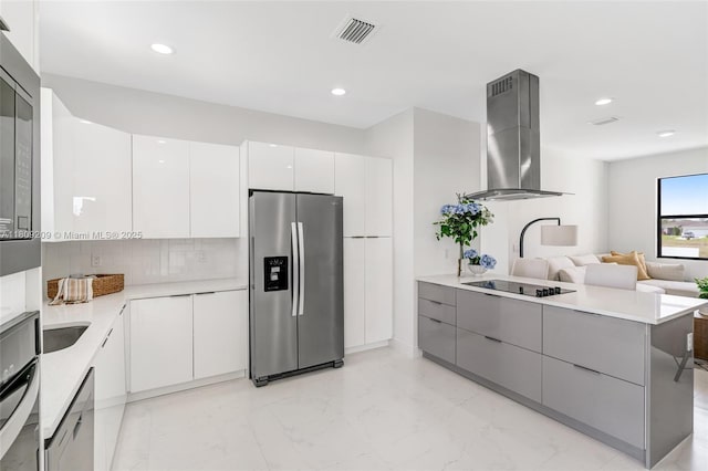 8106 Olive Ct, La Belle, FL 33935 - kitchen featuring appliances with stainless steel finishes, wall chimney range hood, modern cabinets, a peninsula, and recessed lighting