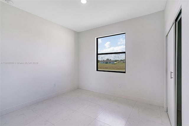 8106 Olive Ct, La Belle, FL 33935 - spare room with light marble finish flooring, baseboards, and recessed lighting