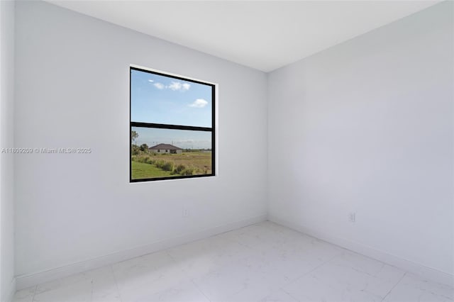 8106 Olive Ct, La Belle, FL 33935 - spare room with light marble finish floors and baseboards
