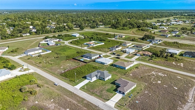 8106 Olive Ct, La Belle, FL 33935 - aerial perspective of suburban area featuring a forest