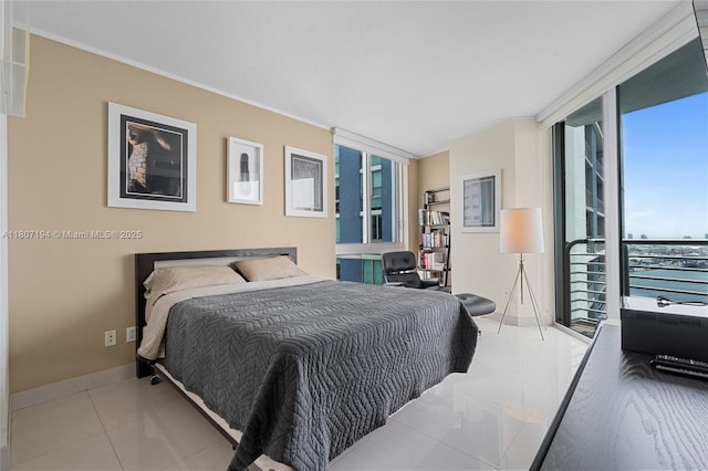 325 S Biscayne Blvd Unit 3926, Miami, FL 33131 - tiled bedroom featuring expansive windows, baseboards, and ornamental molding