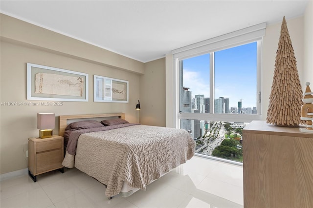 325 S Biscayne Blvd Unit 3926, Miami, FL 33131 - bedroom featuring light tile patterned floors, a skyline view, and crown molding