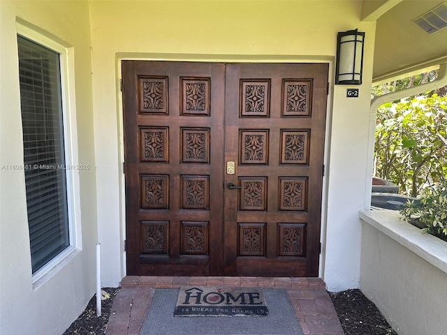 4161 S US Highway 1 Unit G2, Jupiter, FL 33477 - doorway to property featuring a porch and stucco siding