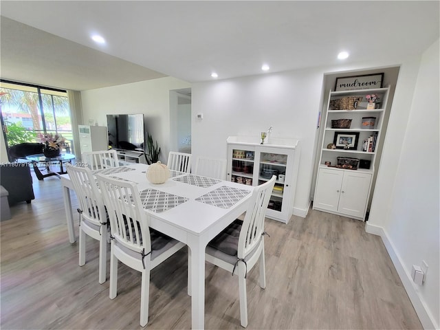 7950 W Mcnab Rd Unit 214, Tamarac, FL 33321 - dining area with light wood-type flooring, recessed lighting, and baseboards