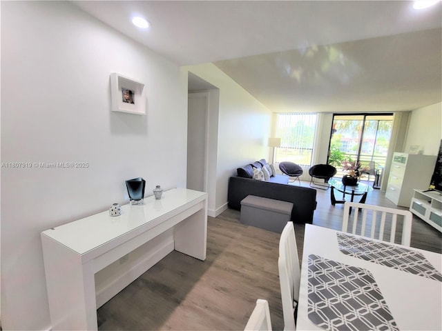 7950 W Mcnab Rd Unit 214, Tamarac, FL 33321 - dining space featuring light wood-type flooring, a wall of windows, an office area, baseboards, and recessed lighting