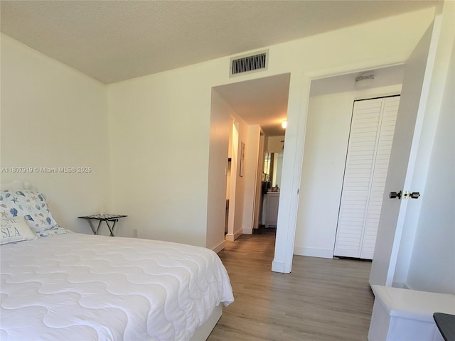 7950 W Mcnab Rd Unit 214, Tamarac, FL 33321 - bedroom featuring light wood-style floors and baseboards