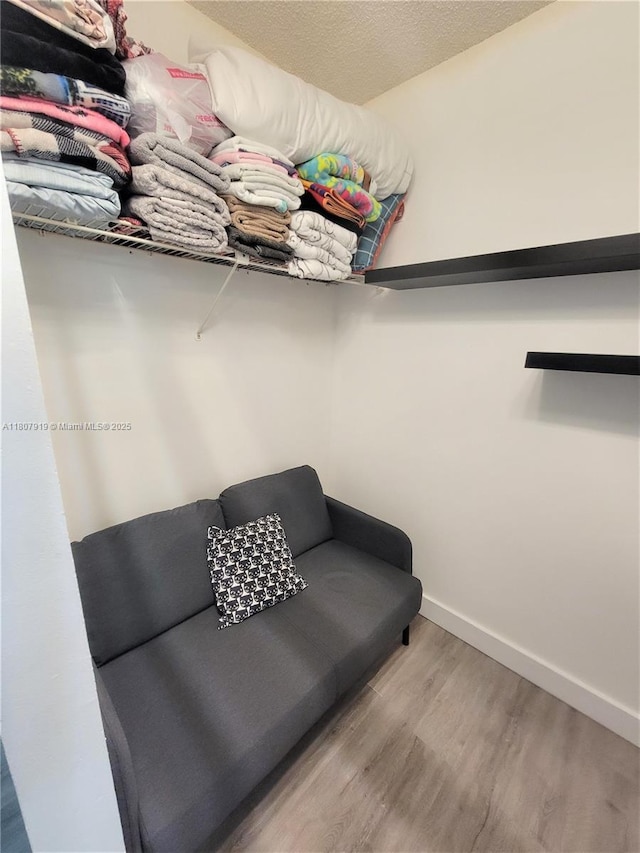 7950 W Mcnab Rd Unit 214, Tamarac, FL 33321 - walk in closet featuring wood finished floors