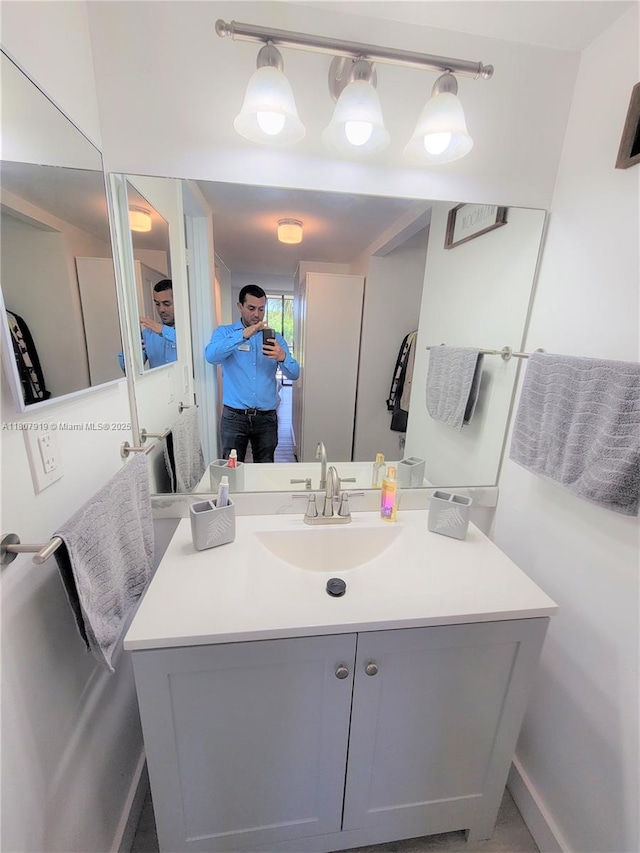 7950 W Mcnab Rd Unit 214, Tamarac, FL 33321 - bathroom with vanity and baseboards