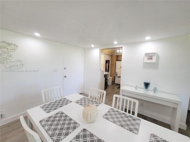 7950 W Mcnab Rd Unit 214, Tamarac, FL 33321 - dining area featuring wood finished floors, recessed lighting, and baseboards