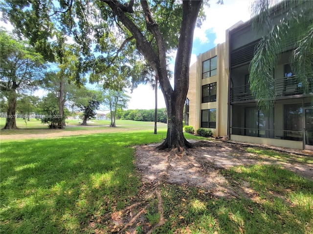 7950 W Mcnab Rd Unit 214, Tamarac, FL 33321 - view of property's community with a lawn