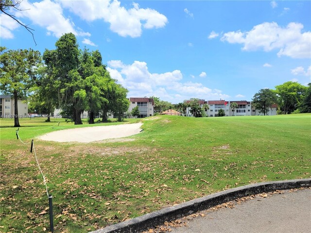 7950 W Mcnab Rd Unit 214, Tamarac, FL 33321 - view of community featuring a lawn