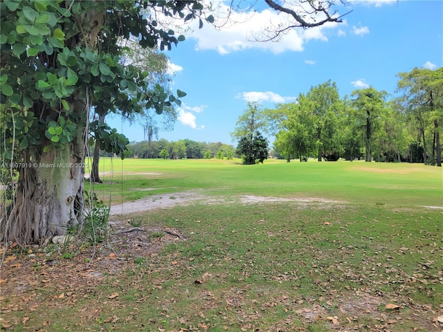 7950 W Mcnab Rd Unit 214, Tamarac, FL 33321 - view of green lawn with view of golf course and view of wooded area