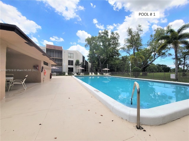 7950 W Mcnab Rd Unit 214, Tamarac, FL 33321 - community pool featuring a patio area
