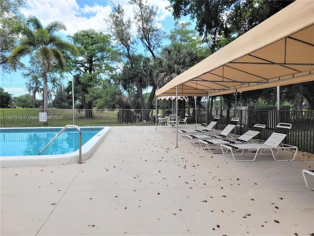 7950 W Mcnab Rd Unit 214, Tamarac, FL 33321 - community pool featuring a patio area
