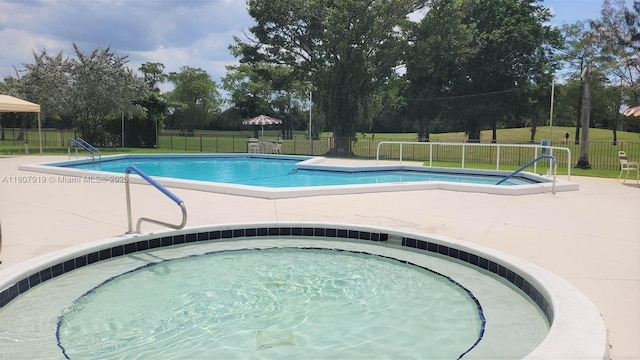 7950 W Mcnab Rd Unit 214, Tamarac, FL 33321 - community pool with a patio area and a community hot tub