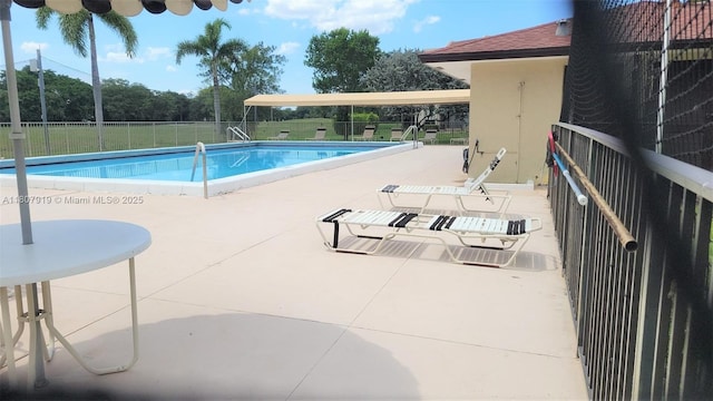7950 W Mcnab Rd Unit 214, Tamarac, FL 33321 - community pool featuring a patio