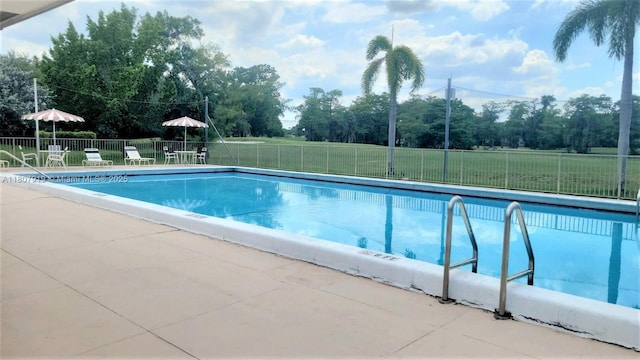 7950 W Mcnab Rd Unit 214, Tamarac, FL 33321 - community pool featuring view of scattered trees and a patio area
