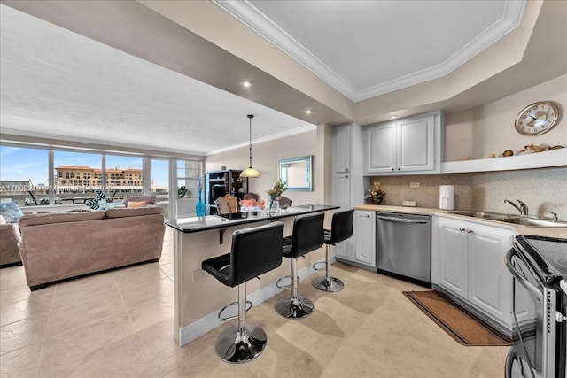 3111 N Ocean Dr Unit 904, Hollywood, FL 33019 - kitchen with dishwasher, crown molding, range with electric stovetop, a kitchen breakfast bar, and open shelves