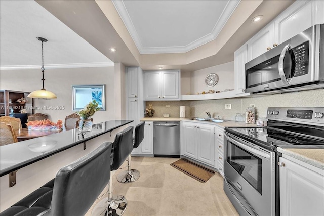 3111 N Ocean Dr Unit 904, Hollywood, FL 33019 - kitchen featuring stainless steel appliances, ornamental molding, open shelves, a sink, and a raised ceiling