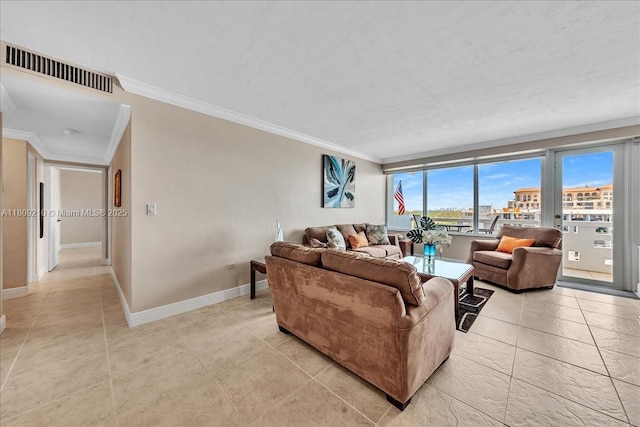3111 N Ocean Dr Unit 904, Hollywood, FL 33019 - living area with crown molding, light tile patterned flooring, and baseboards