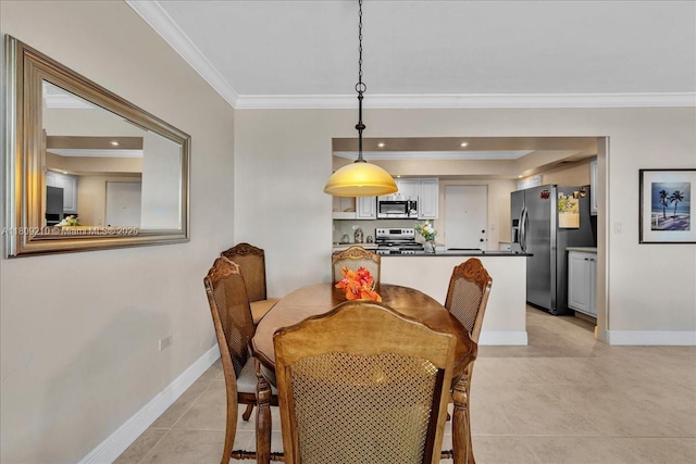 3111 N Ocean Dr Unit 904, Hollywood, FL 33019 - dining room with crown molding, light tile patterned floors, and baseboards