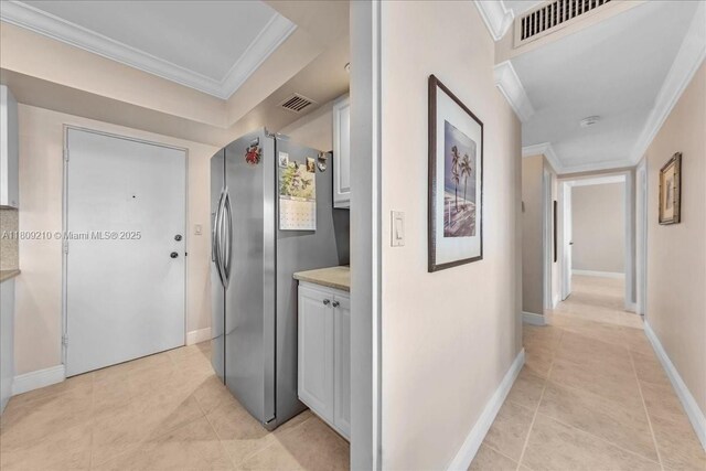 3111 N Ocean Dr Unit 904, Hollywood, FL 33019 - hallway featuring crown molding, light tile patterned floors, and baseboards