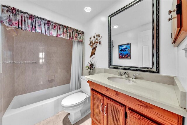 3111 N Ocean Dr Unit 904, Hollywood, FL 33019 - bathroom featuring toilet, vanity, and shower / bathtub combination with curtain