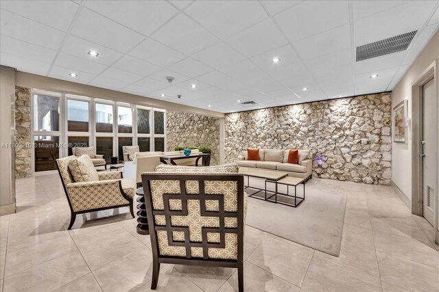 3111 N Ocean Dr Unit 904, Hollywood, FL 33019 - living room featuring a drop ceiling, light tile patterned floors, and recessed lighting