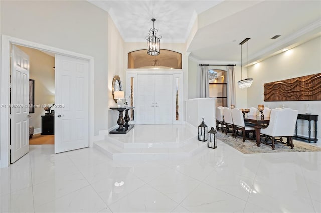 13990 SW 41st St, Davie, FL 33330 - foyer with crown molding, marble finish floors, and a chandelier