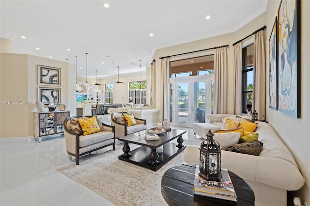 13990 SW 41st St, Davie, FL 33330 - living area with marble tiled floors, recessed lighting, crown molding, and french doors