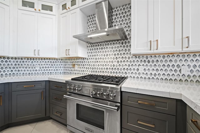 13990 SW 41st St, Davie, FL 33330 - kitchen with high end stove, wall chimney range hood, and white cabinetry