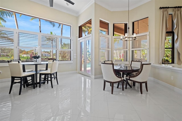 13990 SW 41st St, Davie, FL 33330 - dining space featuring marble tiled flooring, baseboards, ornamental molding, plenty of natural light, and a high ceiling