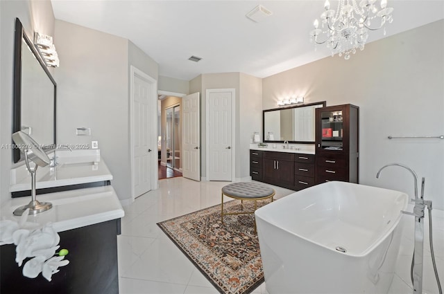 13990 SW 41st St, Davie, FL 33330 - bathroom featuring vanity, a freestanding tub, a chandelier, and baseboards