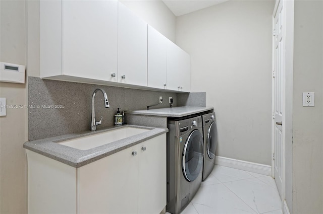 13990 SW 41st St, Davie, FL 33330 - laundry room with washing machine and dryer, cabinet space, and baseboards