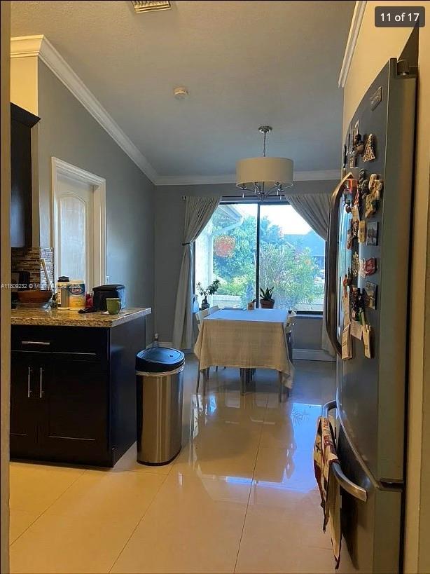 9315 SW 170th Ln, Palmetto Bay, FL 33157 - playroom featuring crown molding and light tile patterned floors