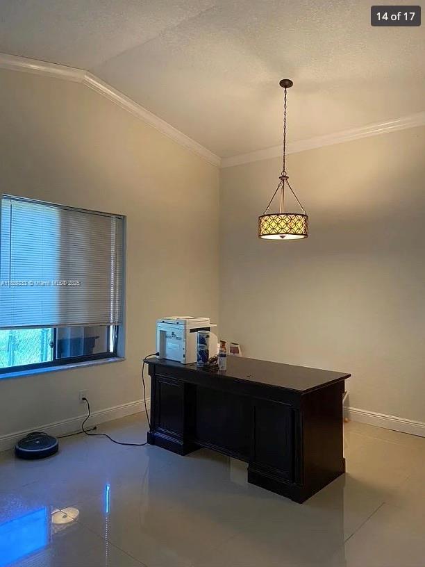 9315 SW 170th Ln, Palmetto Bay, FL 33157 - home office featuring ornamental molding, baseboards, lofted ceiling, and tile patterned floors