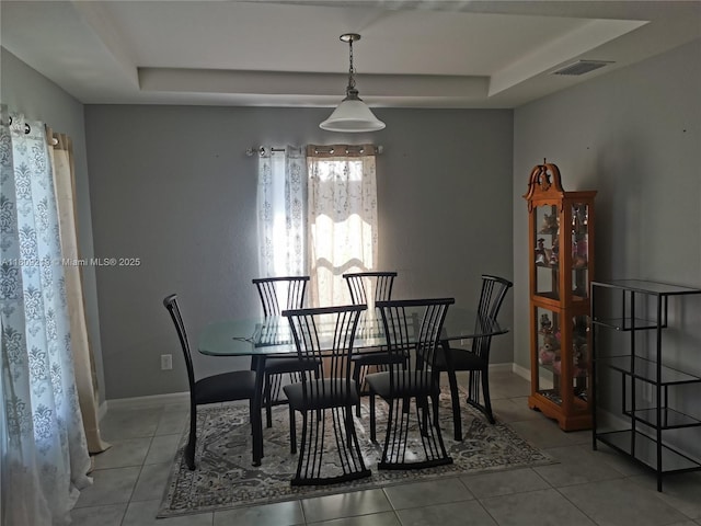 2116 5th Pl, Cape Coral, FL 33909 - tiled dining space featuring a tray ceiling and baseboards