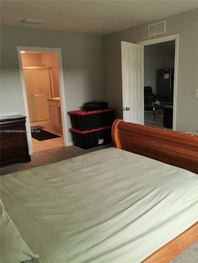 2116 5th Pl, Cape Coral, FL 33909 - bedroom featuring carpet and ensuite bath