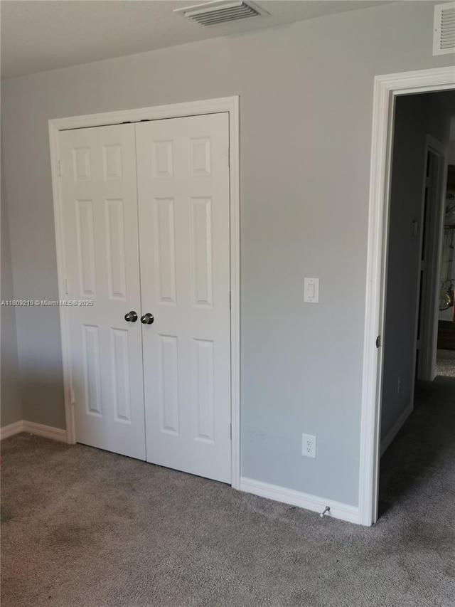 2116 5th Pl, Cape Coral, FL 33909 - unfurnished bedroom featuring carpet floors, baseboards, and a closet