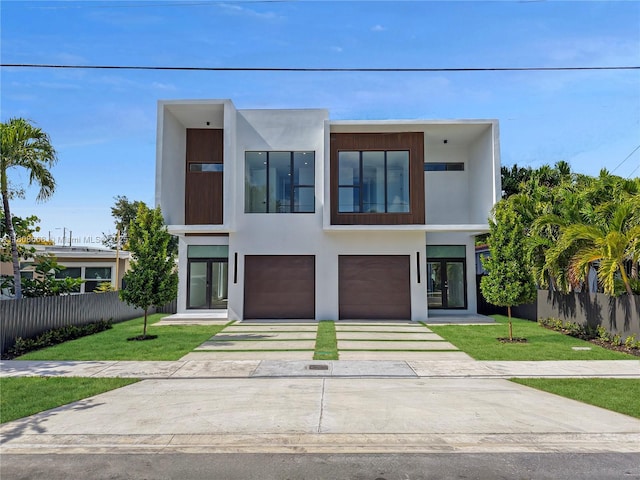 2839 SW 25th St, Miami, FL 33133 - modern home with driveway, stucco siding, and a garage