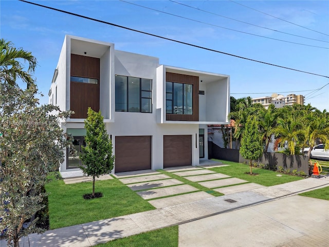 2839 SW 25th St, Miami, FL 33133 - contemporary home featuring driveway, an attached garage, and stucco siding