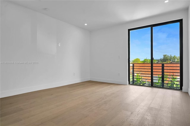 2839 SW 25th St, Miami, FL 33133 - empty room featuring healthy amount of natural light, light wood-style flooring, baseboards, and recessed lighting