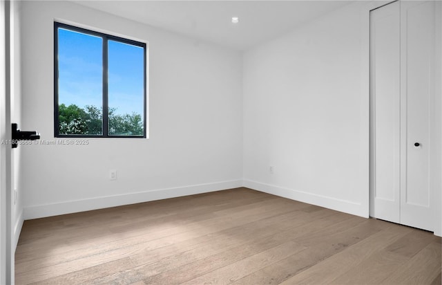 2839 SW 25th St, Miami, FL 33133 - unfurnished bedroom featuring wood finished floors and baseboards