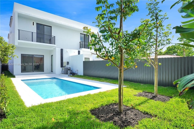 2839 SW 25th St, Miami, FL 33133 - rear view of house with a balcony, stucco siding, and central AC